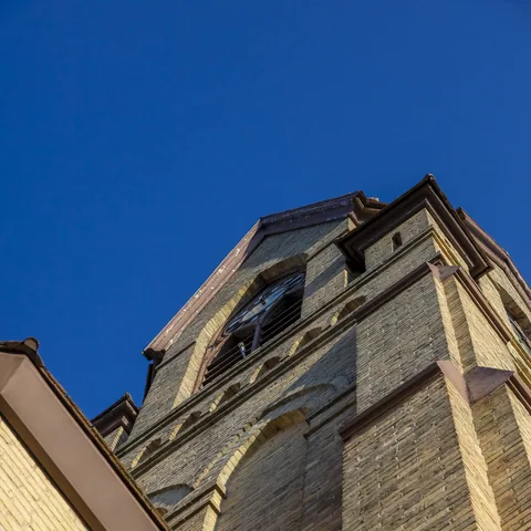 Looking upward along the brick church tower