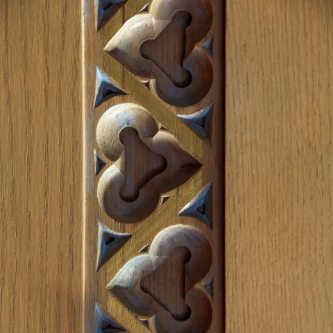 Carved wooden trefoil pattern